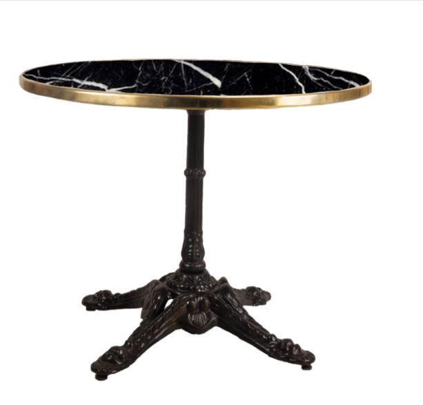mesa redonda de mármol color negro con el canto oro y pie parís